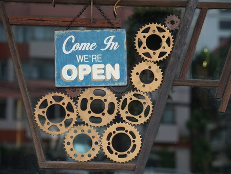 Sign show opening and mirror reflection.の写真素材