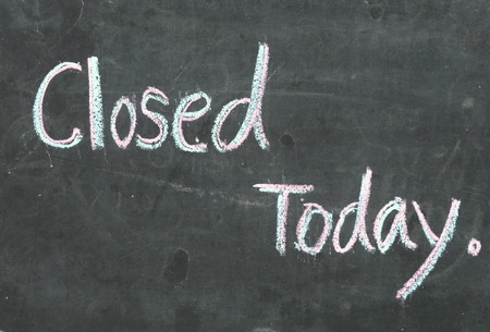 Signs that today are closed,written with color chalk on blackboard.の写真素材