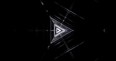 A striking display of geometric shapes features a series of triangles illuminated with bright light...