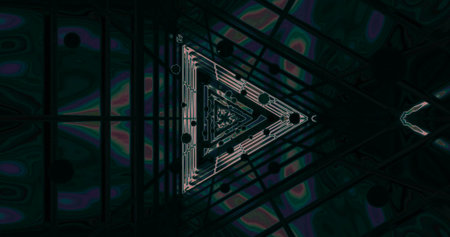 Intricate geometric shapes are highlighted against a dark background, showing vibrant colors and...