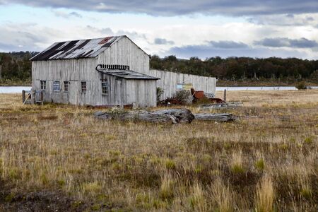 Old farmhouse at fagnano lake near Tolhuin, Tierra del fuego  Argentinaのeditorial素材