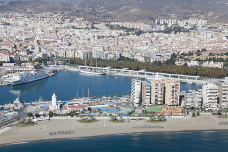 Malaga harbor with its downtown at the back seen from air, Spain.の写真素材
