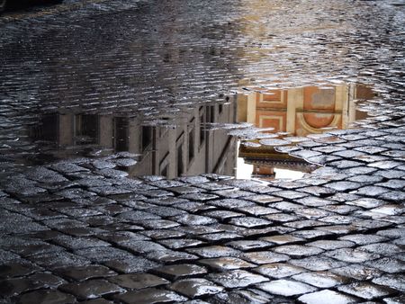 Cobblestone - old street in Rome (Italy). A view just after rain.の写真素材