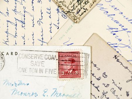 Old postcards with handwriting and a stamp from Canada.の写真素材