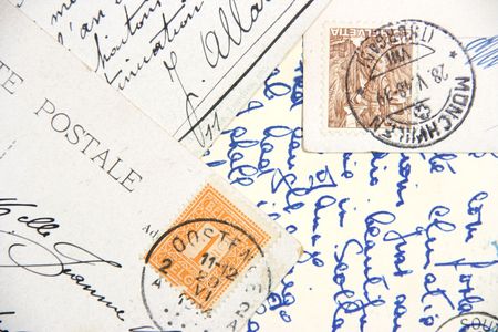 Old postcards with handwriting and stamps from Belgium and Helvetia.の写真素材