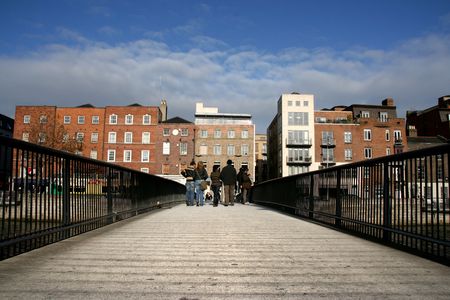 Millennium Bridge over River Liffey in Dublin on a sunny autumn day.の写真素材