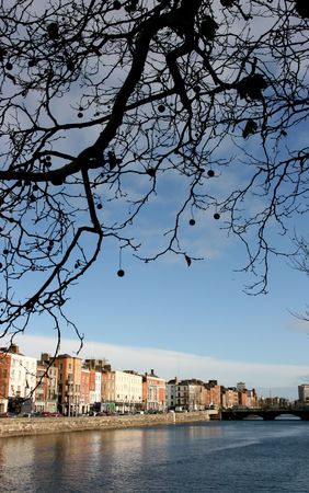River Liffey and colorful buildings of Dublin city. Ireland landmark. Autumn cityscape.