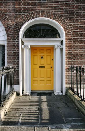 Georgian architecture of Dublin - yellow door in old buildingの写真素材