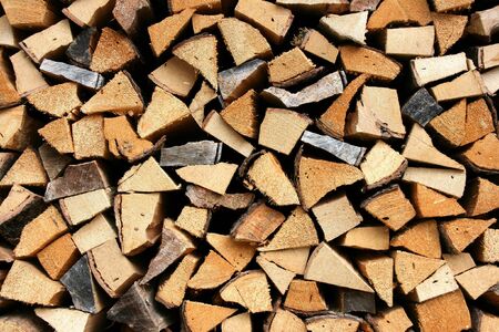 Stack of fresh firewood - wooden abstract . Chopped wood.