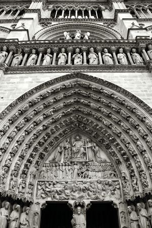 Decoration above the door of Notre Dame cathedral in Paris, France. Black and white.の写真素材