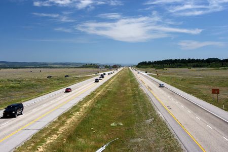 Famous Trans Canada Highway. Plain landscape in Alberta. Vanishing point perspective.