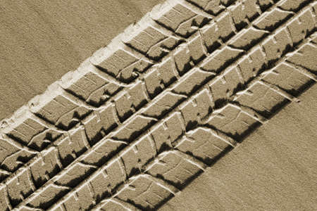 Car tracks in the sand. Beach 4wd background.の写真素材