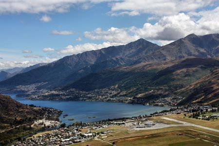 Lake Wakatipu, Frankton and Queenstown visible from The Remarkables - beautiful mountains in New Zealandの写真素材