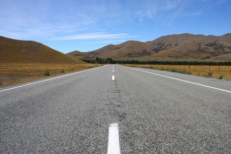 Straight road. Plains and mountains in Canterbury region of New Zealandの写真素材