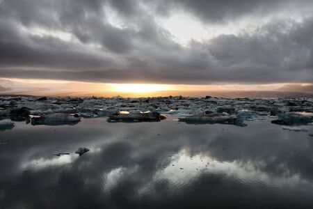 Icebergs on Jokulsarlon lagoon in Iceland. Famous lake. Travel destination for tourists next to Vatnajokull glacier. Sunset.の写真素材