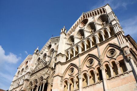 Romanesque facade of famous Ferrara Cathedral in Emilia Romagna region of Italy. Beautiful catholic landmark.の写真素材