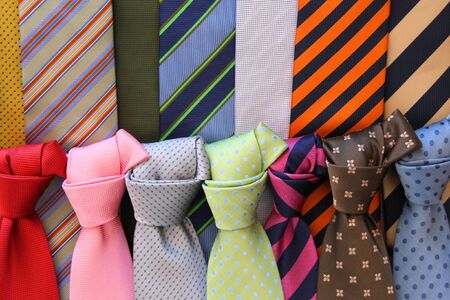 Colorful ties at a shop in Italy. Shopping for elegant dressing accessories. Clothes selection in a store.の写真素材