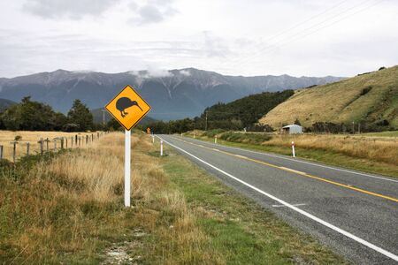 Wildlife warning in New Zealand. Caution, kiwi crossing!の写真素材