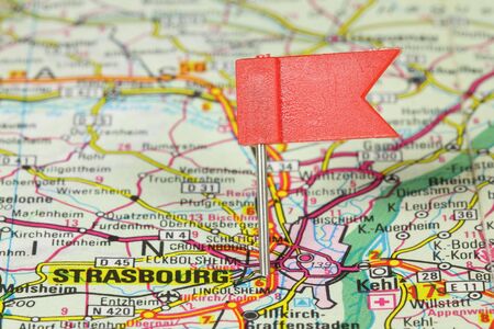 Strasbourg - famous city in France. Red flag pin on an old map showing travel destination.の写真素材