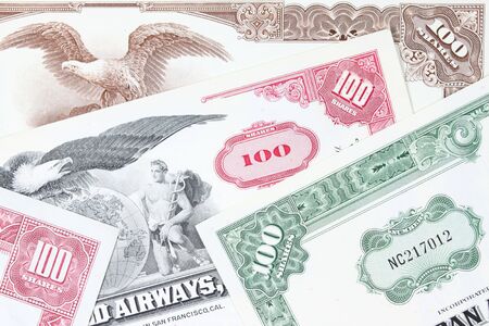 Corporate investing. Old stock share certificates from 1950s-1970s (United States). Vintage scripophily objects.の写真素材