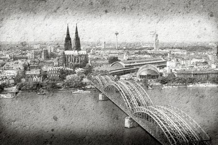 Cologne cityscape with Rhine river and famous cathedral. City in Germany. Grunge harsh version.の写真素材