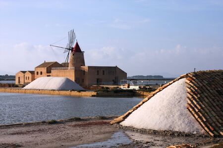 Old windmill in the saltworks of Marsala in Sicily island, Italyの写真素材