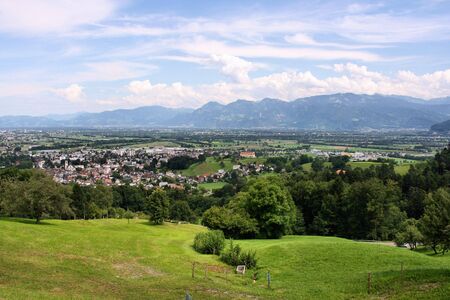 Landscape of Switzerland - green meadows and the Alps. Altstatten town in the canton of St. Gall.