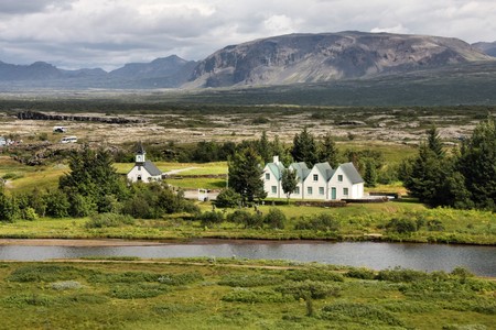 Scenic valley and a village in Thingvellir National Park - famous area in Iceland.の写真素材