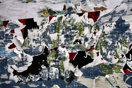 Torn posters on old wall, vandalism and urban decayのeditorial素材