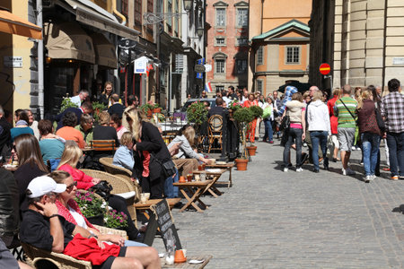 STOCKHOLM - JUNE 1: Tourists at Stortorget square on June 1, 2010 in Stockholm, Sweden. Stortorget is one of the most important squares in the Old Town. Loved by tourists, it is also a typical location by demonstrations.のeditorial素材