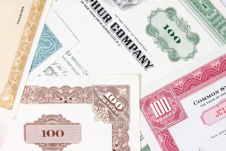 Stock exchange collectibles. Old stock share certificates from 1950s-1970s (United States). Vintage scripophily objects (obsolete).の写真素材