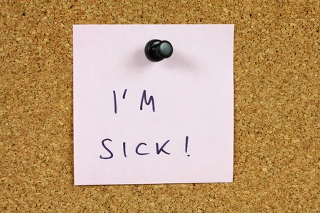 Office message, sticky note pinned to a bulletin board. I'm sick - sickness leave. Office message, sticky note pinned to a bulletin board. I'm sick - sickness leave.