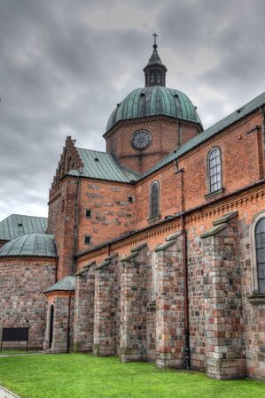 Poland - Plock, city in Masovia (Mazowsze) region. Famous cathedral church incorporating gothic facade, renaissance dome and romanesque architecture.の写真素材