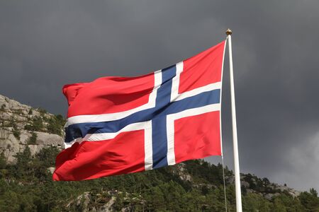 Flag of Norway - national symbol with nature in the background.の写真素材