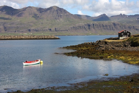 Iceland - Djupivogur, small fishing town. Mountains and fiord.の写真素材