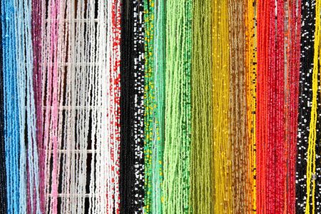 Colorful beads background - necklaces at a store. Abstract jewellery.の写真素材