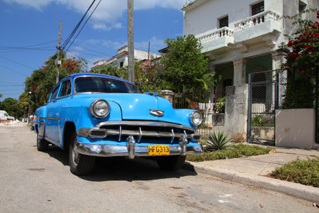 HAVANA - FEBRUARY 24: Classic American Chevrolet car in the street on February 24, 2011 in Havana, Cuba. The multitude of oldtimer cars in Cuba is its major tourism attraction.のeditorial素材