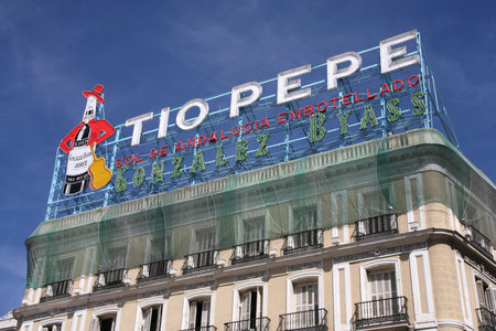 MADRID, SPAIN - SEPTEMBER 2: Tio Pepe advertisement on September 2, 2009 in Madrid, Spain. The famous neon is recognizable in the cityscape of Puerta del Sol area in Madrid.のeditorial素材