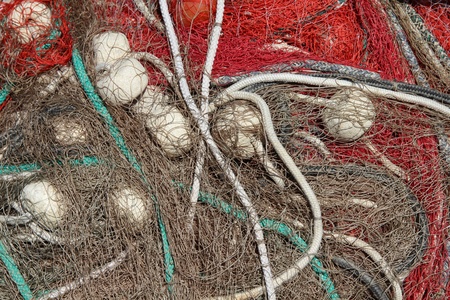 Fishing nets drying in a harbor - abstract background