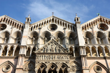 Italy - Romanesque facade of famous Ferrara Cathedral in Emilia Romagna region. Beautiful catholic landmark.のeditorial素材