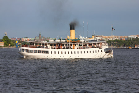 STOCKHOLM - MAY 31: Steamship full of tourists on May 31, 2010 in Stockholm, Sweden. In Stockholm, city of islands, ships and ferries are a popular means to get around.のeditorial素材