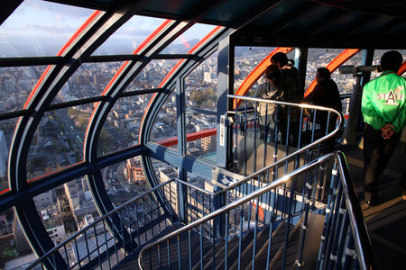 KYOTO, JAPAN - APRIL 14: Tourists visit Kyoto Tower on April 14, 2012 in Kyoto, Japan. Old Kyoto is a UNESCO World Heritage site and was visited by almost 1 million foreign tourists in 2010.のeditorial素材