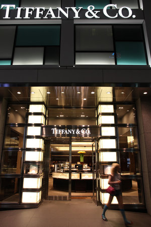 TOKYO - MAY 8: Shopper walks out of Tiffany & Co store May 8, 2012 in Ginza district, Tokyo. According to Millward Brown Tiffany & Co is among top 10 most valuable luxury brands - valued at $2.38 bn USD.のeditorial素材