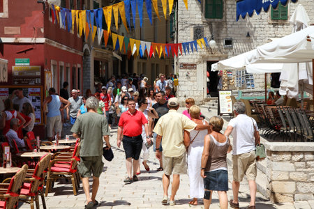 SIBENIK, CROATIA - JUNE 24: People walk the old town streets on June 24, 2011 in Sibenik, Croatia. In 2011 11.2 million tourists visited Croatia, most of them in summer.のeditorial素材