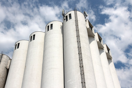 Grain silos at a vegetable oil factory in France. Food production industry.のeditorial素材