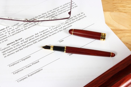 Business objects - full time employment contract ready to sign with ink pen.