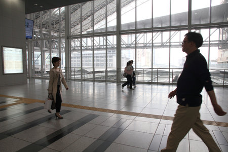 OSAKA, JAPAN - APRIL 25: People hurry at Osaka Station on April 25, 2012 in Osaka, Japan. It is the 3rd busiest station in the world serving average 2.4 million passengers daily.のeditorial素材