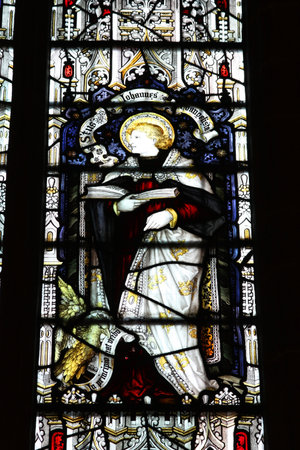 WOLVERHAMPTON, UK - MARCH 10: Stained glass Saint John Evangelist in St Peter's Collegiate Church on March 10, 2010 in Wolverhampton, UK. The famous church dates back to 12th century. WOLVERHAMPTON, UK - MARCH 10: Stained glass Saint John Evangelist in St Peter's Collegiate Church on March 10, 2010 in Wolverhampton, UK. The famous church dates back to 12th century.