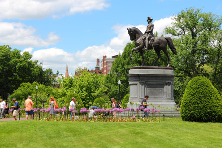 BOSTON - JUNE 9: People visit George Washington statue in famous Public Garden on June 9, 2013 in Boston. Public Garden dates back to 1837 and is a registered monument.のeditorial素材