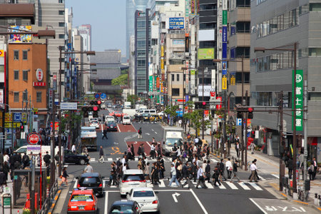 TOKYO - MAY 10: Commuters hurry on May 10, 2012 in Minato district, Tokyo. Tokyo is the capital city...